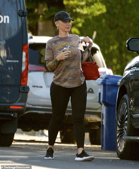 Amber Rose cuts a casual figure in camouflage print top